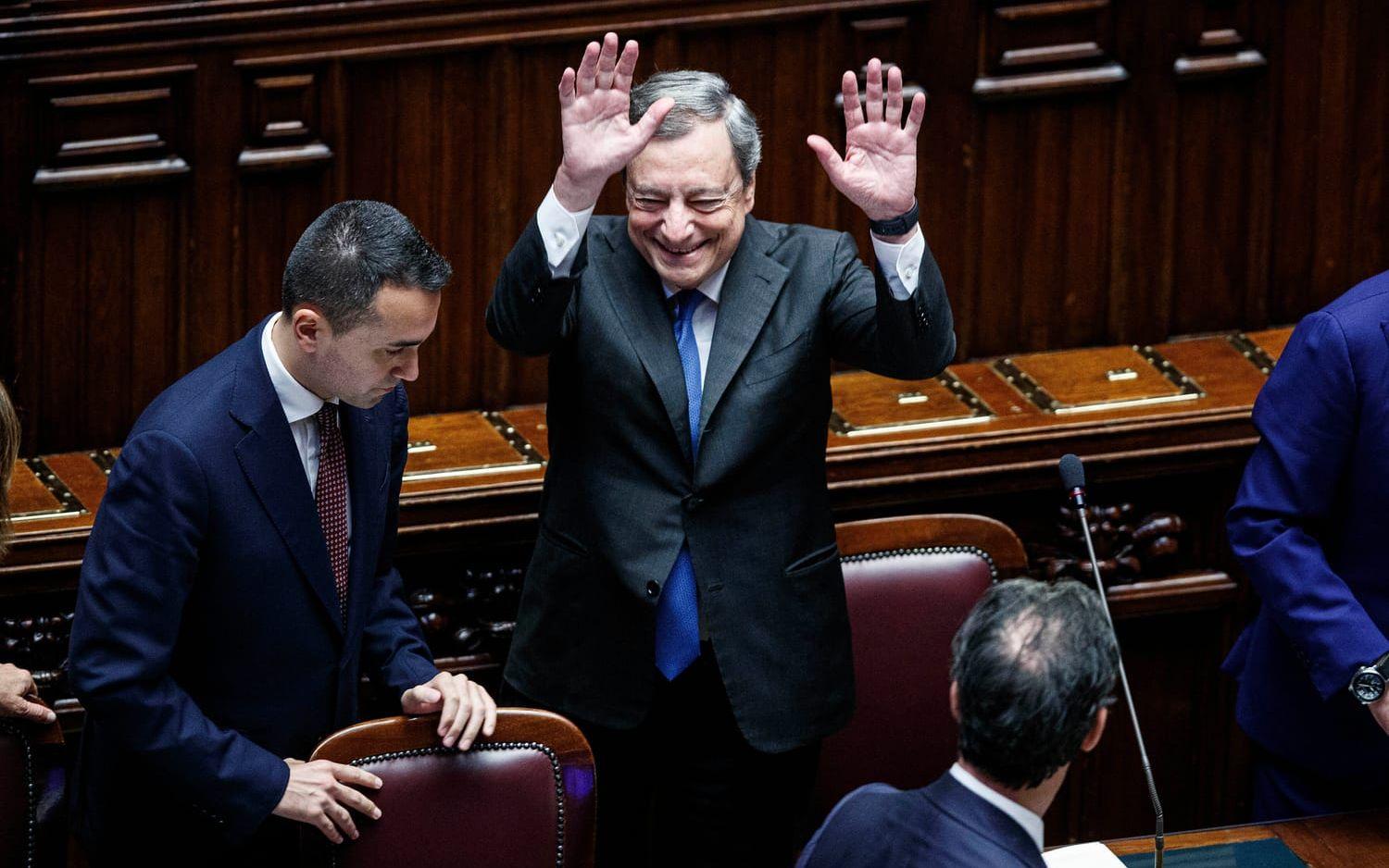 Italian Premier Mario Draghi waves after delivering his address at the Parliament in Rome, Thursday, July 21, 2022. Premier Mario Draghi's national unity government headed for collapse Thursday after key coalition allies boycotted a confidence vote, signaling the likelihood of early elections and a renewed period of uncertainty for Italy and Europe at a critical time. (Roberto Monaldo/LaPresse via AP)  FP101